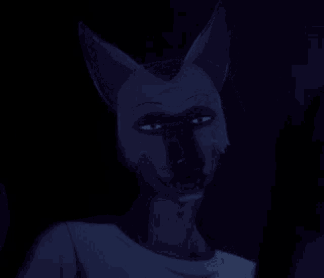 a cartoon character with a fox mask on his face is giving a peace sign .