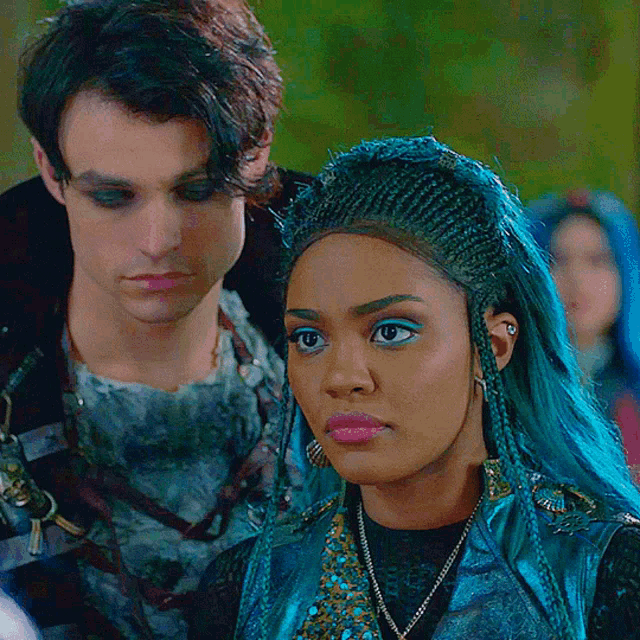 a man and a woman standing next to each other