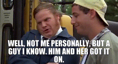 two men are sitting next to each other in a bus and one of them is talking to the other .