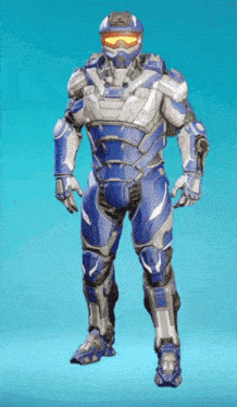 a man in a blue and silver futuristic armor with a helmet and goggles