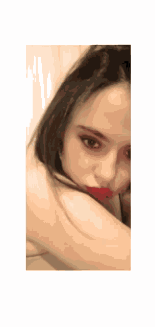 a close up of a woman with red lipstick on her lips