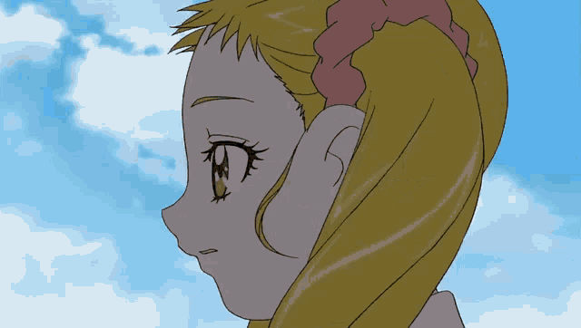 a girl with blonde hair and a pink scrunchie on her head