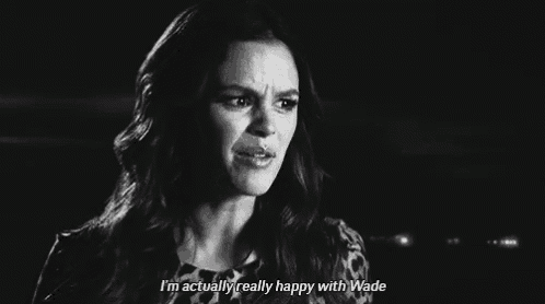 a black and white photo of a woman crying and saying `` i 'm actually really happy with wade ''
