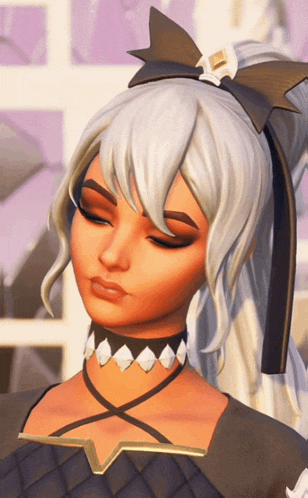 a close up of a girl with a bow in her hair