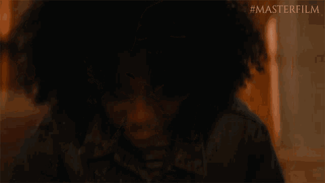 a woman drinking from a glass with #masterfilm on the bottom right