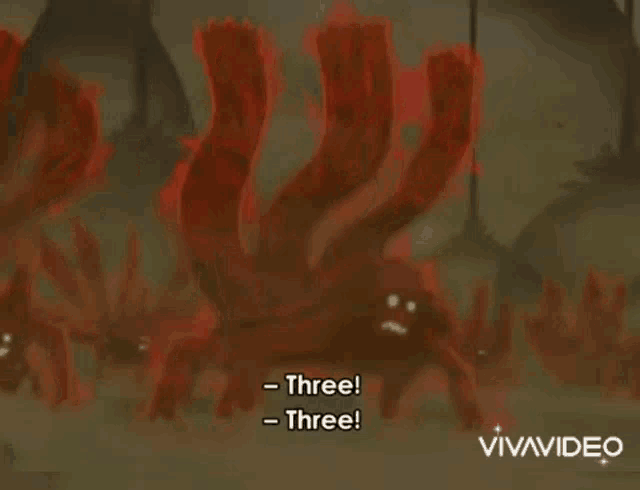 a group of red monsters are standing next to each other in a cartoon .