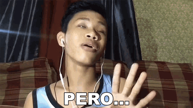 a young man wearing ear buds says pero in spanish