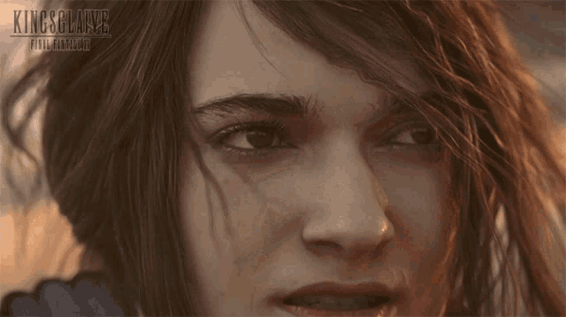 a close up of a woman 's face with the words kingsglaive final fantasy written above her