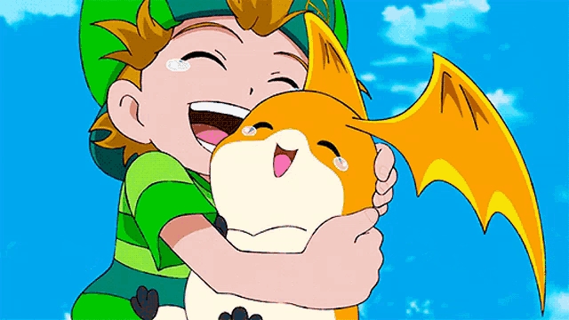 a boy in a green hat is hugging an orange and white cartoon character