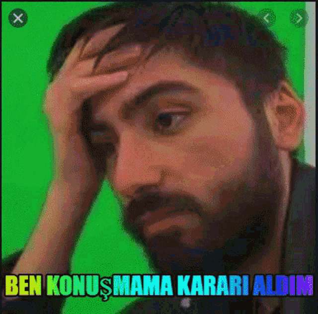 a man with green hair and a beard is holding his hand to his forehead and the words ben konusmama karai aldim are above him