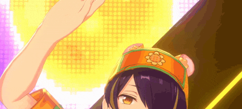 a close up of a person wearing an orange hat with a flower on it .
