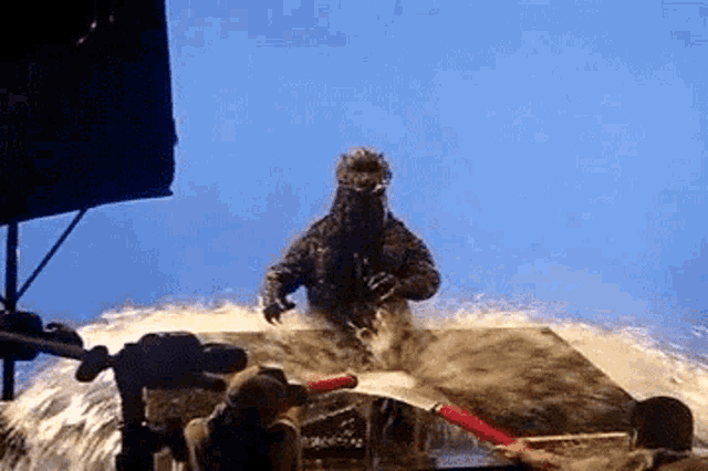 a monster is being sprayed with water by a man