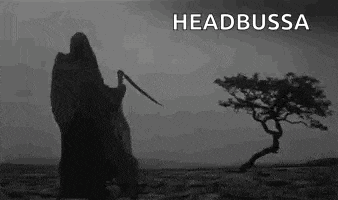 a grim reaper with a scythe is standing in front of a tree in the desert .