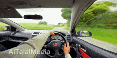 a video of a person driving a car with the words altalmedia written on the bottom