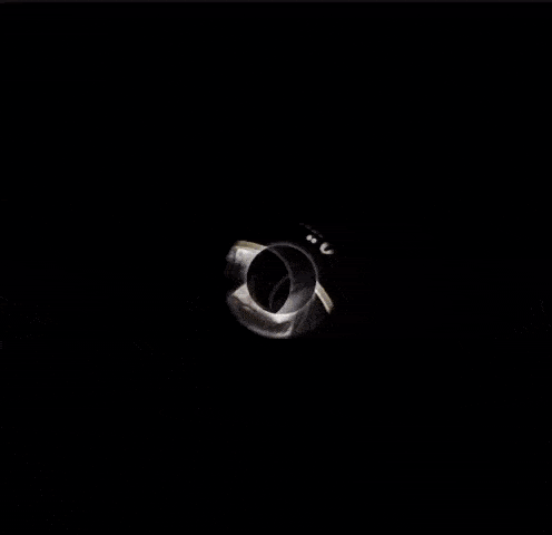 a black and white circle with a few dots on it