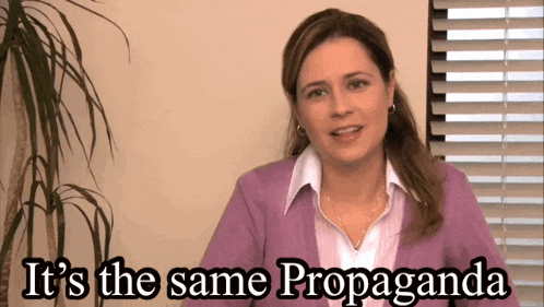 a woman says it 's the same propaganda in front of a window