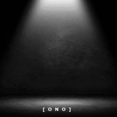 a spotlight is shining on a black wall and floor .
