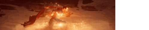 a blurred image of a person surrounded by fire and smoke .