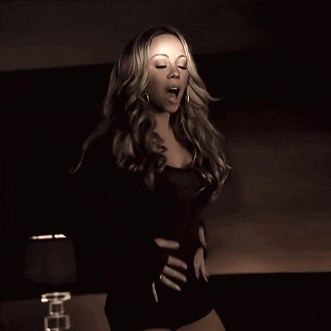 a woman with her eyes closed and her mouth open
