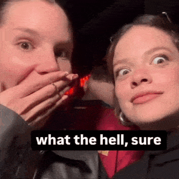 two women are making funny faces and one of them is covering her mouth .