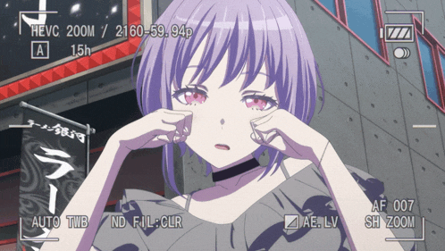 a girl with purple hair is being filmed by a camera with hevc 200m / 2160-59.94p