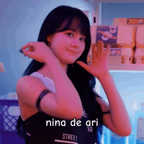 a girl in a black tank top that says street on it