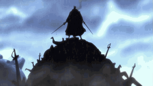 a silhouette of a man with two swords standing on top of a hill