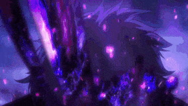 a close up of a person 's face with purple and pink lights coming out of it .