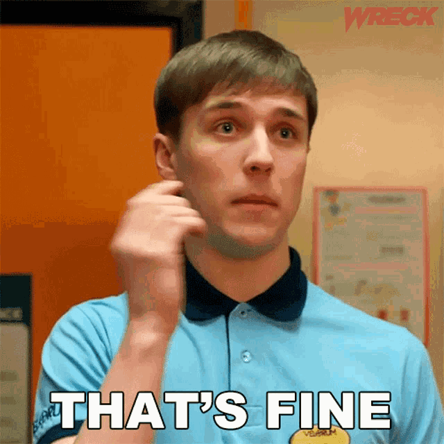 a man in a blue shirt says that 's fine in front of an orange door