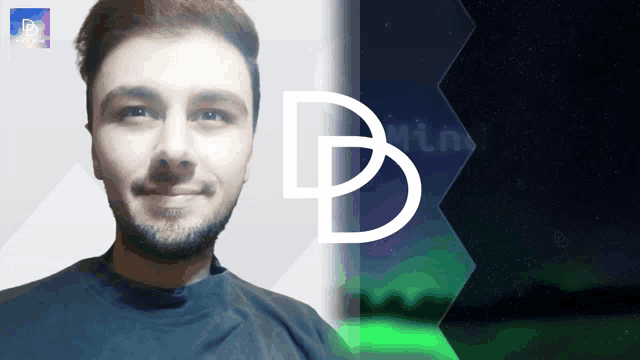 a man with a beard is smiling in front of a logo that has the letter b