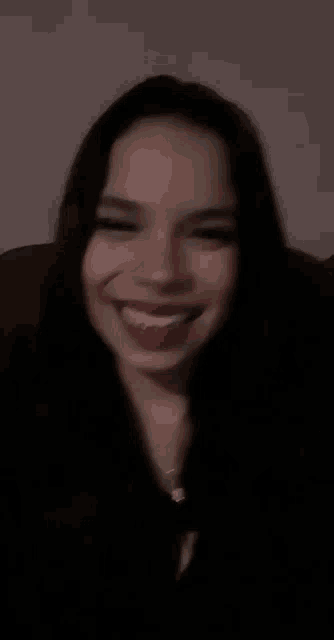 a woman with red lips is giving the peace sign