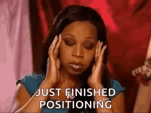 a woman is covering her ears with her hands and says `` just finished positioning '' .