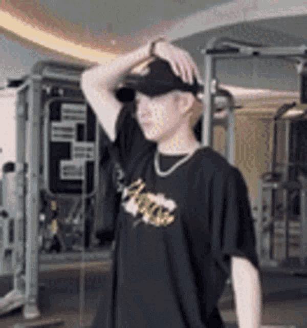 a man wearing a black t-shirt that says ' chicago ' on it