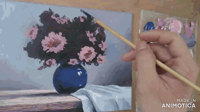 a painting of flowers in a blue vase is made in animoto