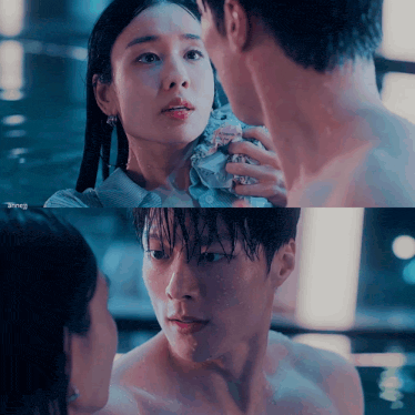 a man and a woman are looking into each other 's eyes while a man is naked