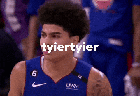 a basketball player with the word tyier tyier on his chest