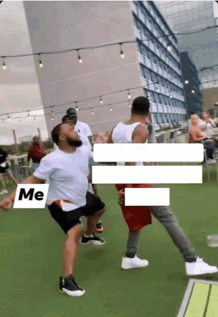 a group of men are dancing on a grassy field with a sign that says me on it