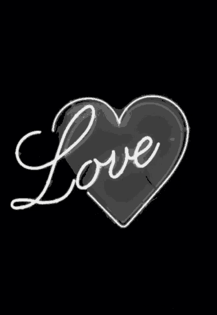 a neon sign that says love in a heart on a black background .
