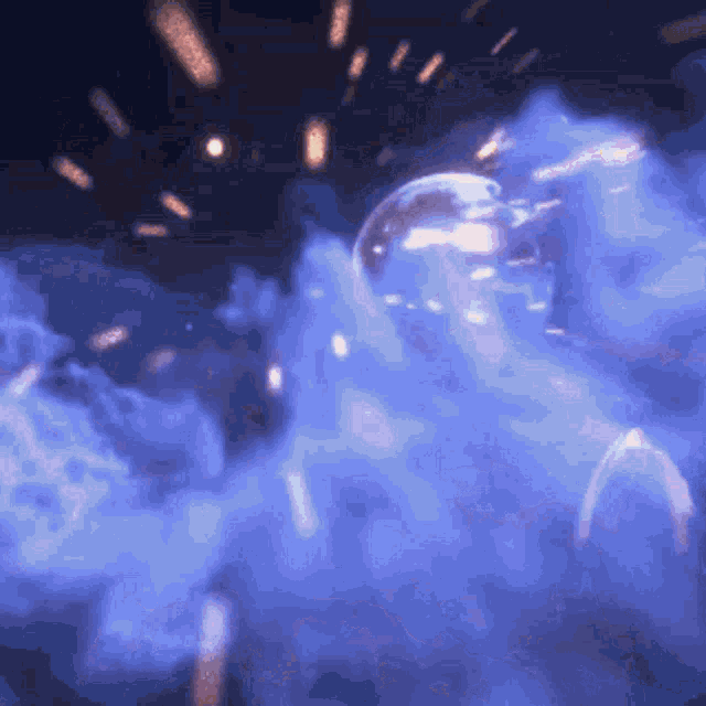a glowing object is surrounded by blue smoke