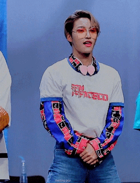 a young man wearing a shirt that says san francisco on it