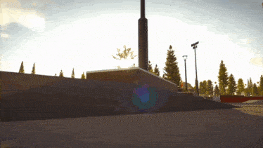 a person riding a skateboard on a ramp in a park