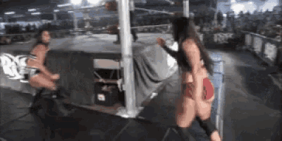two women are wrestling in a ring with the word rvc on the side