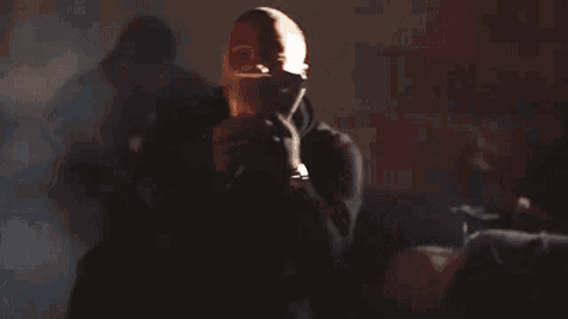 a man is wearing boxing gloves and holding a stack of money .