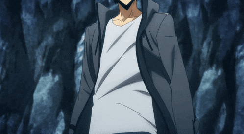 a man in a black jacket and white shirt stands in front of a blue background
