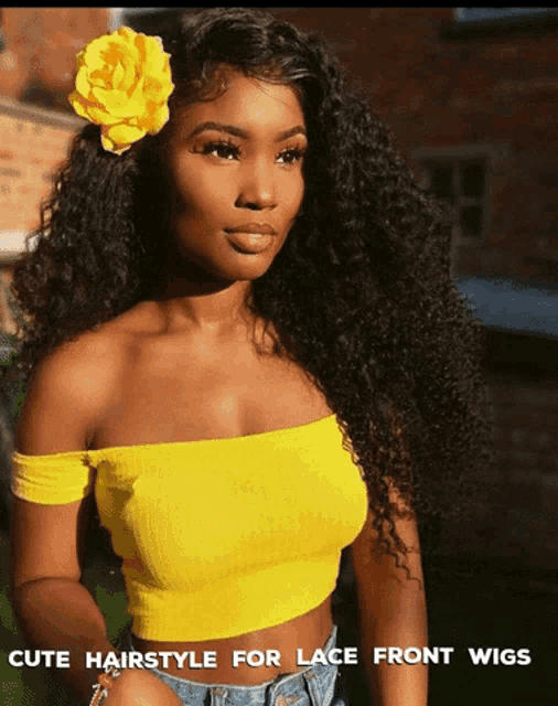 a woman wearing a yellow off the shoulder top with a flower in her hair