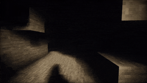 a man in a suit and tie is standing in a dark cave