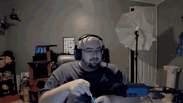 a man wearing headphones and a shirt that says atlanta braves