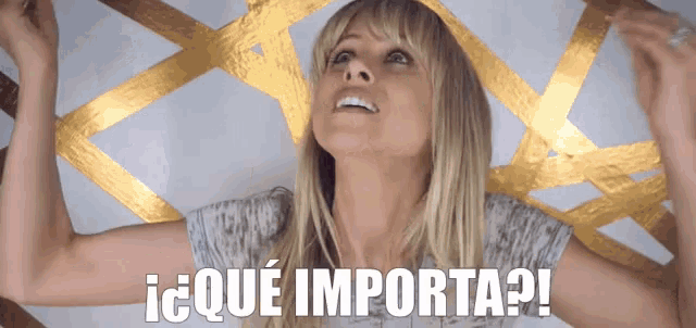 a woman in a white shirt is smiling with the words que importa on the bottom