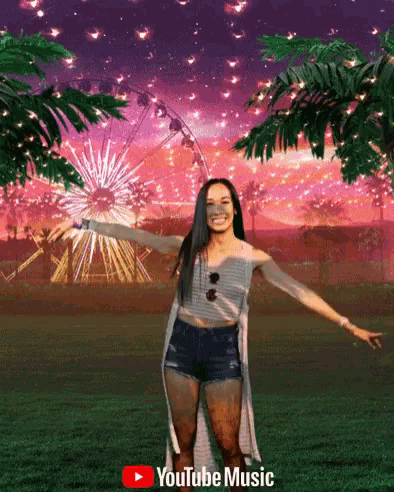 a woman is standing in front of a ferris wheel and a youtube music logo