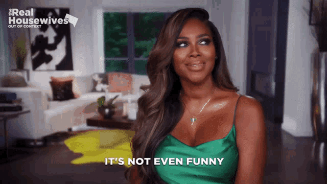 a woman says it 's not even funny in front of a couch